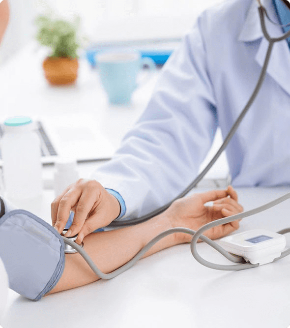 A doctor is checking the blood pressure of someone.