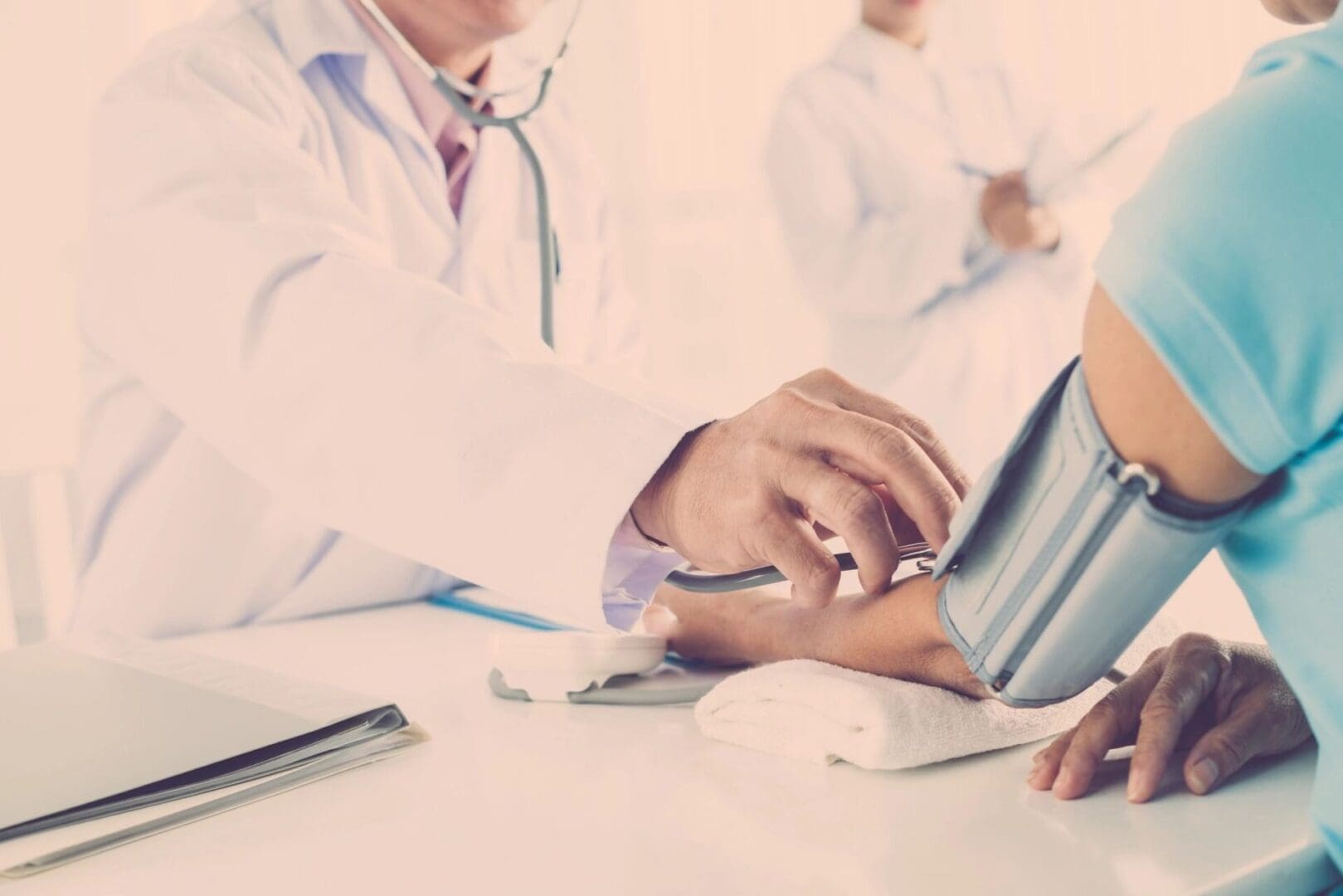 A group of doctors sitting around a table.