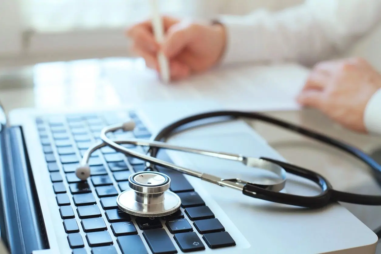 Stethoscope on a laptop keyboard.