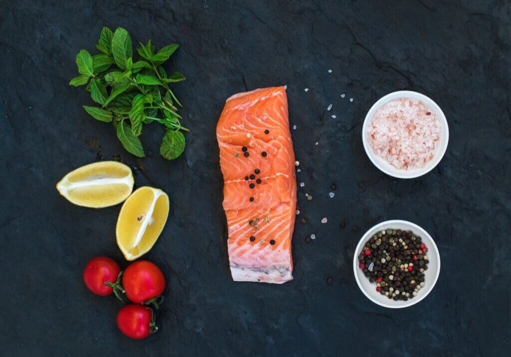 Raw salmon with lemons, herbs, and spices.