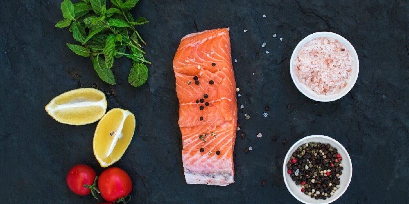 Raw salmon with lemons, herbs, and spices.